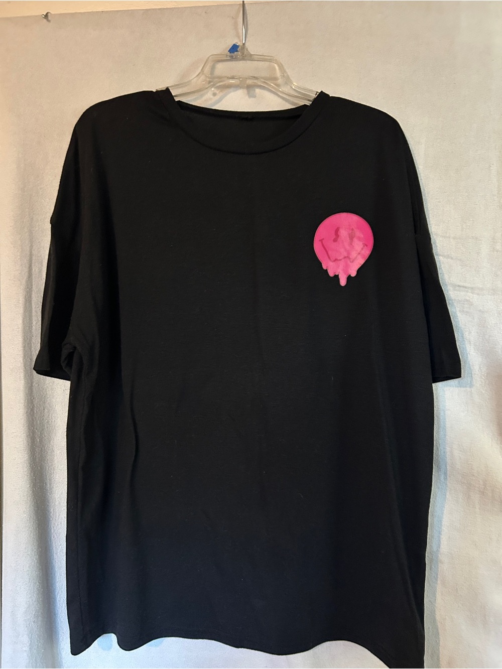 Black Men's Graphic Tee with Pink Melt Design on front saying on back.
